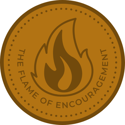 A coin stamped with a flame and a motto that reads 