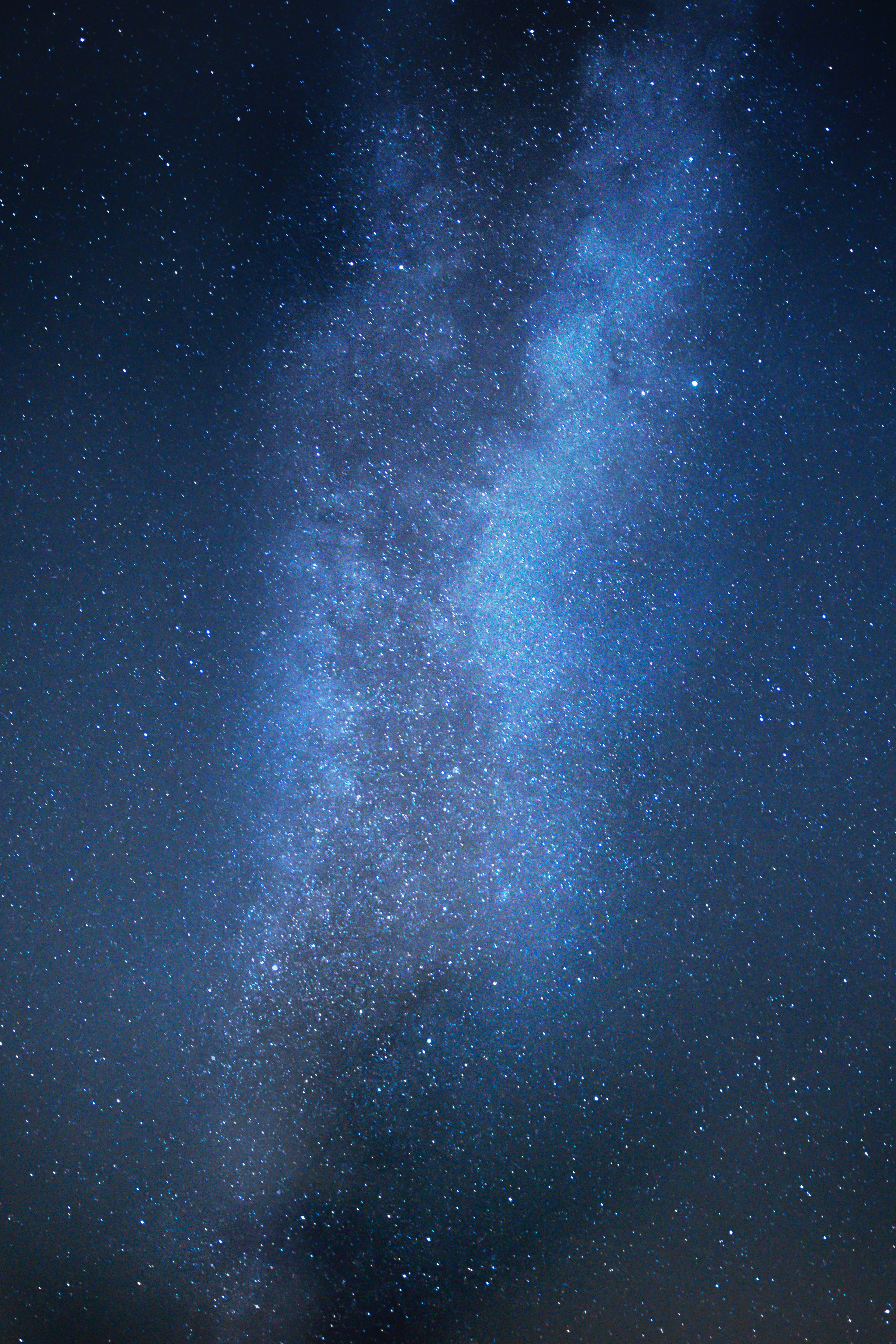 The Milky Way gleaming with blue and silver light