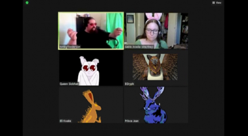 Two people, one with bunny ears, plus a bat, a griffon, a fiery rabbit and a jackalope in a Zoom call